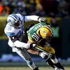 GREEN BAY, WI - DECEMBER 28: Ryan Grant #25 of the Green Bay Packers is pulled down by Leigh Bodden #28 of the Detroit Lions on December 28, 2008 at Lambeau Field in Green Bay, Wisconsin. The Packers defeated the Lions 31-21. (Photo by Jonathan Daniel/Get