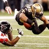 NEW ORLEANS - DECEMBER 07:  Reggie Bush #25 of the New Orleans Saints is tripped by Jason Snelling #44 of the Atlanta Falcons on December 7, 2008 at the Superdome in New Orleans, Louisiana.  (Photo by Chris Graythen/Getty Images)