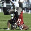 TAMPA, FL - DECEMBER 28: Wide receiver Antonio Bryant #89 of the Tampa Bay Buccaneers tumbles after a midfield catch against the Oakland Raiders at Raymond James Stadium on December 28, 2008 in Tampa, Florida.  (Photo by Al Messerschmidt/Getty Images)