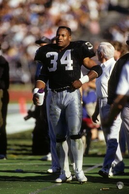 LOS ANGELES - JANUARY 13:  Running back Bo Jackson #34 of Los Angeles Raiders stands on the sidelines during the 1990 AFC Divisional Playoffs against the Cincinnati Bengals at the Los Angeles Memorial Coliseum on January 13, 1991 in Los Angeles, Californi