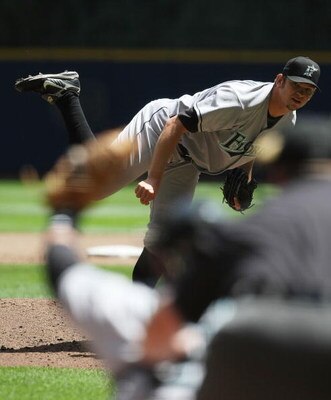 MILWAUKEE - MAY 14: Starting pitcher Josh Johnson #55 of the Florida Marlins delivers the ball against the Milwaukee Brewers on May 14, 2009 at Miller Park in Milwaukee, Wisconsin. The Brewers defeated the Marlins 5-3. (Photo by Jonathan Daniel/Getty Imag