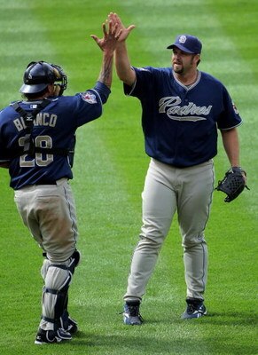 DENVER - MAY 31:  Relief pitcher Heath Bell #21 of the San Diego Padres celebrates with catcher Henry Blanco #28 after closing against the Colorado Rockies during MLB action at Coors Field on May 31, 2009 in Denver, Colorado. Bell earned the save as the P