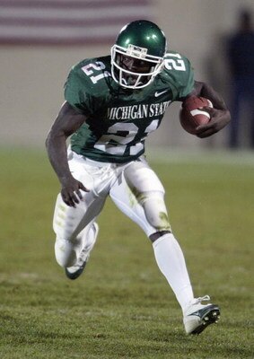 EAST LANSING, MI - NOVEMBER 13:  Running back DeAndra Cobb #21 of the Michigan State Spartans runs upfield against the Wisconsin Badgers during the game at Spartan Stadium on November 13, 2004 in East Lansing, Michigan. Michigan State defeated Wisconsin 4