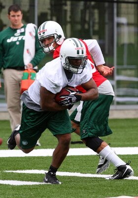 FLORHAM PARK, NJ - MAY 02:  Shonn Greene #23 of the New York Jets takes a hand off from Mark Sanchez #6 during minicamp on May 2, 2009 at the Atlantic Health Jets Training Center in Florham Park, New Jersey.  (Photo by Jim McIsaac/Getty Images)