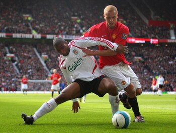 MANCHESTER, UNITED KINGDOM - MARCH 23:  Wes Brown of Manchester United battles for the ball with Ryan Babel of Liverpool during the Barclays Premier League match between Manchester United and Liverpool at Old Trafford on March 23, 2008 in Manchester, Engl