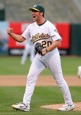 OAKLAND, CA - OCTOBER 06:   Huston Street #20 of the Oakland Athletics celebrates after making the final out against the Minnesota Twins to win game three of the American League Division Series at McAfee Coliseum on October 6, 2006 in Oakland, California.