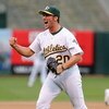 OAKLAND, CA - OCTOBER 06:   Huston Street #20 of the Oakland Athletics celebrates after making the final out against the Minnesota Twins to win game three of the American League Division Series at McAfee Coliseum on October 6, 2006 in Oakland, California.