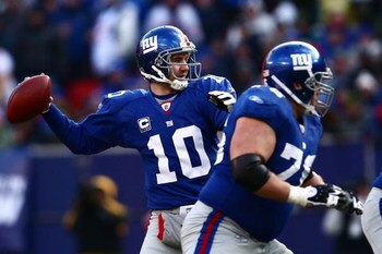 EAST RUTHERFORD, NJ - JANUARY 11:  Eli Manning #10 of the New York Giants passes against the Philadelphia Eagles during the NFC Divisional Playoff Game on January 11, 2009 at Giants Stadium in East Rutherford, New Jersey.  (Photo by Chris McGrath/Getty Im