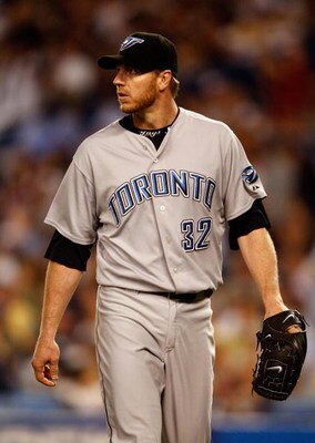 NEW YORK - JUNE 03:  Roy Halladay #32 of the Toronto Blue Jays walks to the dugout against the New York Yankees on June 3, 2008 at Yankee Stadium in the Bronx borough of New York City.  (Photo by Nick Laham/Getty Images)