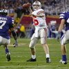TEMPE, AZ - JANUARY 2:  Quarterback Craig Krenzel #16 of Ohio State looks for an open man against the defense of Kansas State during the first half of the Fiesta Bowl on January 2, 2004 at the Sun Devil Stadium in Tempe, Arizona.  (Photo by Jed Jacobsohn/