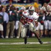 TEMPE, AZ - JANUARY 3:  Running back Maurice Clarett #13 of the Ohio State Buckeyes finds a hole against the University of Miami Hurricanes during the Tostitos Fiesta Bowl at Sun Devil Stadium on January 3, 2003 in Tempe, Arizona.  Ohio State won the game
