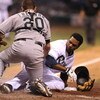ST PETERSBURG, FL - JUNE 13:  Infielder Willy Aybar #16 of the Tampa Bay Rays topples catcher Matt Treanor #20 the Florida Marlins at Tropicana Field June 13, 2008 in St. Petersburg, Florida.  (Photo by Al Messerschmidt/Getty Images)