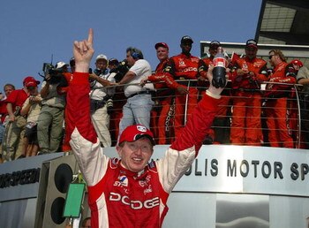INDIANAPOLIS - AUGUST 4:  Bill Elliott, driver of the #9 Evernham Motorsports Dodge intrepid R\T, celebrates after winning the NASCAR Winston Cup Brickyard 400 on  August 4, 2002 during  at Indianapolis Motor Speedway in Indianapolis, Indiana. (Photo by J