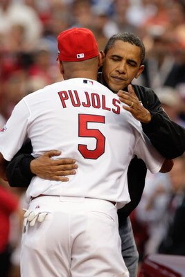 ST. LOUIS, MO - JULY 14:  President Barack Obama hugs National League All-Star Albert Pujols of the St. Louis Cardinals after throwing the first pitch before the 2009 MLB All-Star Game at Busch Stadium on July 14, 2009 in St Louis, Missouri. (Photo by Jam