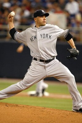 MINNEAPOLIS, MN - JULY 9:  Alferedo Aceves #91 of the New York Yankees pitches against the Minnesota Twins at Hubert H. Humphrey Metrodome on July 9, 2008 in Minneapolis, Minnesota. The Yankees defeated the Twins 6-4. (Photo by Scott Boehm/Getty Images)