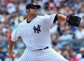 NEW YORK - JULY 19:  Joba Chamberlain #62 of the New York Yankees pitches against the Detroit Tigers on July 19, 2009 at Yankee Stadium in the Bronx borough of New York City.  (Photo by Jim McIsaac/Getty Images)