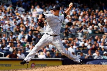 NEW YORK - APRIL 16:  Phil Coke #48 of the New York Yankees pitches against the Cleveland Indians during opening day at the new Yankee Stadium on April 16, 2009 in the Bronx borough of New York City. This is the first regular season MLB game being played 