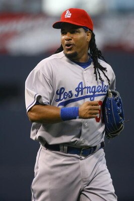 SAN DIEGO - JULY 03:  Manny Ramirez #99 of the Los Angeles Dodgers runs back to the dugout during the game against the San Diego Padres at Petco Park on July 3, 2009 in San Diego, California.  (Photo by Jeff Gross/Getty Images)