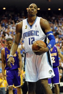 ORLANDO, FL - JUNE 14:  Dwight Howard #12 of the Orlando Magic reacts in the third quarter of Game Five of the 2009 NBA Finals against the Los Angeles Lakers on June 14, 2009 at Amway Arena in Orlando, Florida.  NOTE TO USER:  User expressly acknowledges 