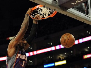 LOS ANGELES, CA - DECEMBER 10:  Amare Stoudemire #1 of the Phoenix Suns dunks against the Los Angeles Lakers during the first half at the Staples Center on December 10, 2008 in Los Angeles, California.   NOTE TO USER: User expressly acknowledges and agree