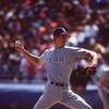 TEXAS RANGERS PITCHER KEVIN BROWN DELIVERS A PITCH DURING THE 1992 MAJOR LEAGUE BASEBALL SEASON AT COMISKEY PARK IN CHICAGO, ILLINOIS.