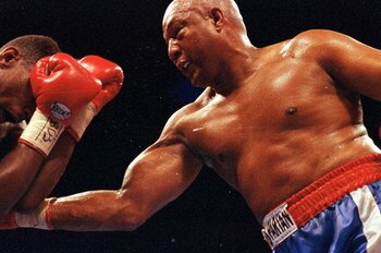 11 Apr 1992: George Foreman makes a right puch during a fight against Alex Stewart. Mandatory Credit: Holly  Stein  /Allsport
