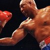 11 Apr 1992: George Foreman makes a right puch during a fight against Alex Stewart. Mandatory Credit: Holly  Stein  /Allsport