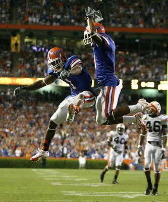 GAINESVILLE, FL - SEPTEMBER 29:  Wide receivers Percy Harvin #1 and Louis Murphy #9 of the Florida Gators celebrate Harvin's catch that set up the game tying touchdown in the fourth quarter against the Auburn Tigers at Ben Hill Griffin Stadium September 2