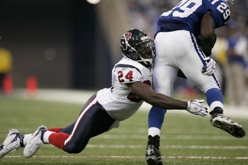 INDIANAPOLIS - SEPTEMBER 17:  Safety C.C. Brown #24 of the Houston Texans tackles running back Joseph Addai #29 of the Indianapolis Colts during the game on September 17, 2006 at the RCA Dome in Indianapolis, Indiana. The Colts won 43-24.  (Photo by Brian