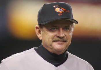 BRONX, NY - APRIL 8:  Baltimore Orioles first base coach Rick Dempsey looks on against the New York Yankees during the game at Yankee Stadium on April 8, 2005 in Bronx, New York.  The Orioles defeated the Yankees 12-5.  (Photo by Jim McIsaac/Getty Images)