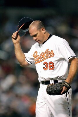 BALTIMORE, MD - AUGUST 9:  Jason Grimsley #38 of the Baltimore Orioles pitches during the game with the Tampa Bay Devil Rays on August 9, 2005 at Camden Yards in Baltimore, Maryland.  (Photo By Jamie Squire/Getty Images)
