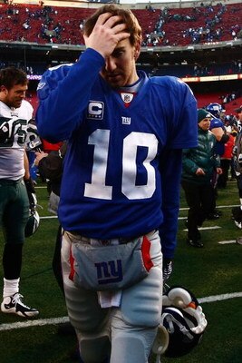 EAST RUTHERFORD, NJ - JANUARY 11:  Eli Manning #10 of the New York Giants walks off the field after losing to the Philadelphia Eagles during the NFC Divisional Playoff Game on January 11, 2009 at Giants Stadium in East Rutherford, New Jersey.The Eagles wo
