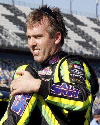 DAYTONA BEACH, FL - FEBRUARY 08:  Jeremy Mayfield, driver of the #41 All Sport Toyota, climbs from his car during qualifying for the NASCAR Sprint Cup Series Daytona 500 at Daytona International Speedway on February 8, 2009 in Daytona Beach, Florida.  (Ph