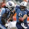 CINCINNATI - SEPTEMBER 14:  Kerry Collins #5 of the Tennessee Titans hands the ball off to Chris Johnson #28 against the Cincinnati Bengals during the third quarter of their NFL game September 14, 2008 at Paul Brown Stadium in Cincinnati, Ohio. The Titans