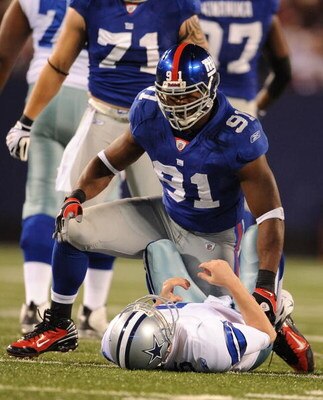 EAST RUTHERFORD, NJ - NOVEMBER 02:  Justin Tuck #91 of the New York Giants sacks Brooks Bollinger #5 of the Dallas Cowboys during their game on November 2, 2008 at Giants Stadium in East Rutherford, New Jersey.  (Photo by Al Bello/Getty Images)