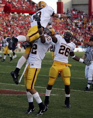 TUCSON, AZ - NOVEMBER 25:  Chris McGaha #13, Jamaal Lewis #82 and Ryan Torain #26 of the Arizona State Sun Devils celebrate after scoring a touchdown in the first half of the game against the Arizona Wildcats at Arizona Stadium on November 25, 2006 in Tuc