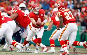 KANSAS CITY, MO - DECEMBER 14:  Tyler Thigpen #4 of the Kansas City Chiefs handsoff to Larry Johnson #27 against the San Diego Chargers during the first half on December 14, 2008 at Arrowhead Stadium in Kansas City, Missouri. The Chiefs lost 22-21.  (Phot