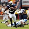 AUBURN, AL - OCTOBER 23:  Ronnie Brown #23 of Auburn Tigers avoids a tackle by Lamar Mills #45 of Kentucky Wildcats on October 23, 2004 at Jordan-Hare stadium in Auburn, Alabama. Auburn defeated Kentucky 41-10. (Photo by Chris Graythen/Getty Images)  