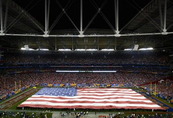 GLENDALE, AZ - JANUARY 08:  A USA flag covers the field during the National Anthem for the 2007 Tostitos BCS National Championship Game between the Florida Gators and the Ohio State Buckeyes at the University of Phoenix Stadium on January 8, 2007 in Glend