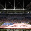 GLENDALE, AZ - JANUARY 08:  A USA flag covers the field during the National Anthem for the 2007 Tostitos BCS National Championship Game between the Florida Gators and the Ohio State Buckeyes at the University of Phoenix Stadium on January 8, 2007 in Glend