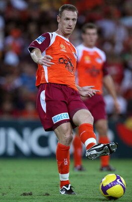 BRISBANE, AUSTRALIA - FEBRUARY 13:  Craig Moore of the Roar passes the ball during the minor semi final 2nd leg match between the Queensland Roar and the Central Coast Mariners held at Suncorp Stadium on February 13, 2009 in Brisbane, Australia.  (Photo b