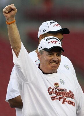 TAMPA, FL - DECEMBER 06:  Head coach Frank Beamer of the Virginia Tech Hokies celebrates on the podium after defeating the Boston College Eagles in the 2008 ACC Football Championship game at the Raymond James Stadium on December 6, 2008 in Tampa, Florida.