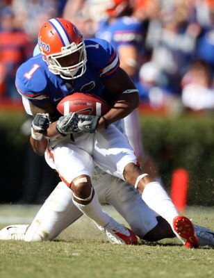 GAINESVILLE, FL - NOVEMBER 22:  Percy Harvin #1 of the Florida Gators catches a pass against Demetrius Jackson #1 of the Citadel Bulldogs during the game at Ben Hill Griffin Stadium on November 22, 2008 in Gainesville, Florida.  (Photo by Sam Greenwood/Ge