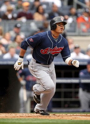 NEW YORK - APRIL 19:  Shin-soo Choo #17 of the Cleveland Indians hits a home run in the second inning of their game against the New York Yankees at Yankee Stadium on April 19, 2009 in the Bronx borough of New York City.  (Photo by Ezra Shaw/Getty Images)