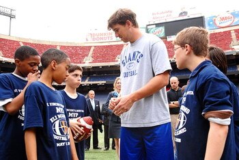 EAST RUTHERFORD, NJ - MAY 15:  Eli Manning of the New York Giants participates in a clinic sponsored by St Vincent's Hospital Manhattan at Giants Stadium on May 15, 2008 in East Rutherford, New Jersey  (Photo by Rob Loud/Getty Images for St. Vincent's Hos