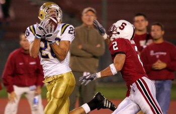 PALO ALTO, CA - OCTOBER 29:  Joe Cowan #26 of the UCLA Bruins makes a catch for a touchdown in the fourth quarter as Nick Sanchez #2 tries to block the pass on October 29, 2005 at Stanford Stadium in Palo Alto, California. The Bruins went on to defeat the