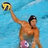 BEIJING - AUGUST 16:  Tony Azevedo of the United States passes over Aljosa Kunac of Croatia during their water polo match at the Ying Tung Natatorium on Day 8 of the Beijing 2008 Olympic Games on August 16, 2008 in Beijing, China.  (Photo by Clive Brunski