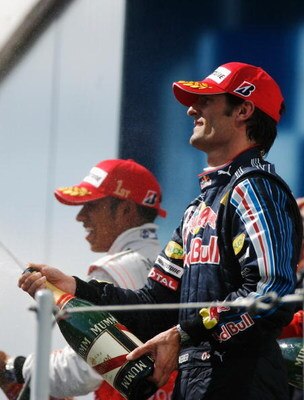 BUDAPEST, HUNGARY - JULY 26:  Mark Webber of Australia and Red Bull Racing celebrates on the podium after finishing third during the Hungarian Formula One Grand Prix at the Hungaroring on July 26, 2009 in Budapest, Hungary.  (Photo by Paul Gilham/Getty Im