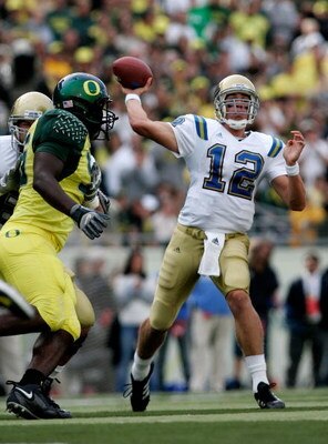 EUGENE, OR - OCTOBER 14:  UCLA Bruins' Quarterback Patrick Cowan #12 throws against the Oregon Ducks at Autzen Stadium October 14, 2006 in Eugene, Oregon.  (Photo by Jonathan Ferrey/Getty Images)
