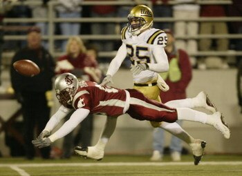 PULLMAN, WA - NOVEMBER 8:  Wide Receiver Ryan Smith #25 of the U.C.L.A. Bruins and Karl Paymah #15 of the Washington State University Cougars on an overthrown  pass on November 8, 2003 at Martin Stadium in Pullman, Washington. (Photo by Otto Greule Jr/Get